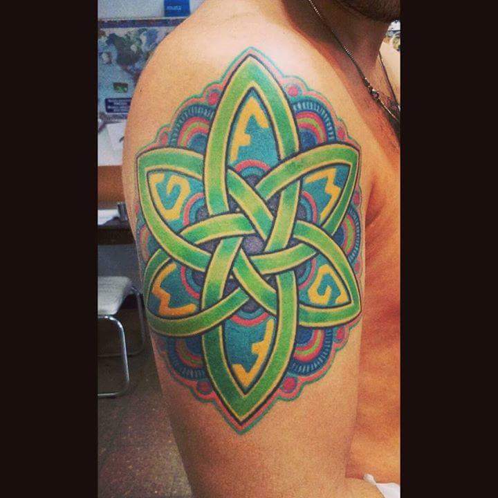 Artist working on tattoo